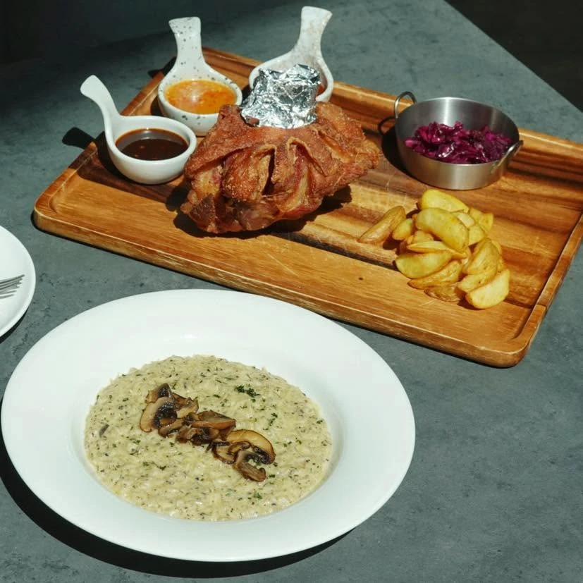 German pork knuckle and mushroom risotto at UPPER·T