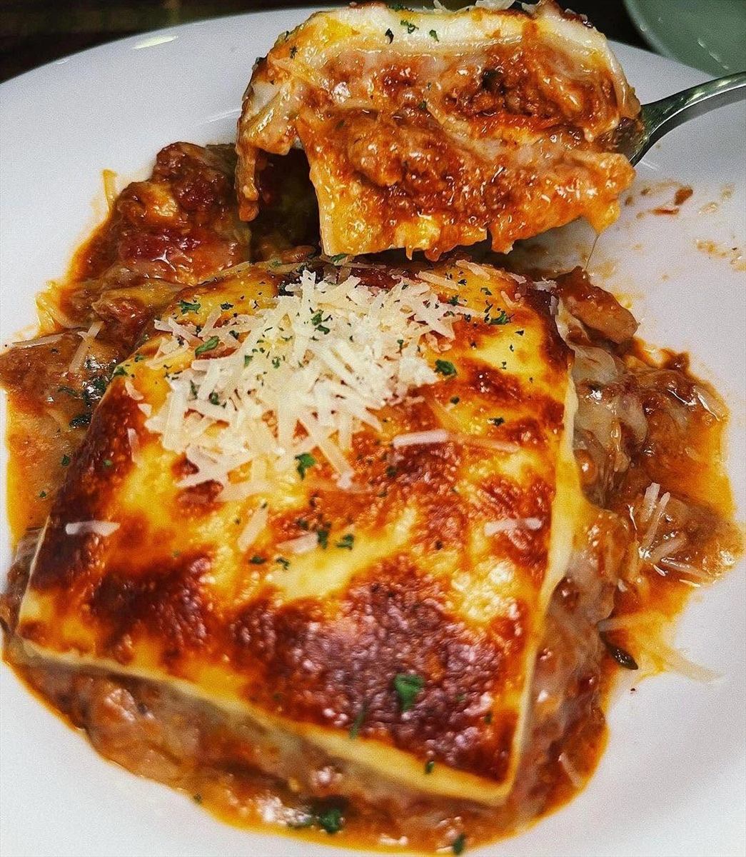 Baked lasagna with parmesan at UPPER·T